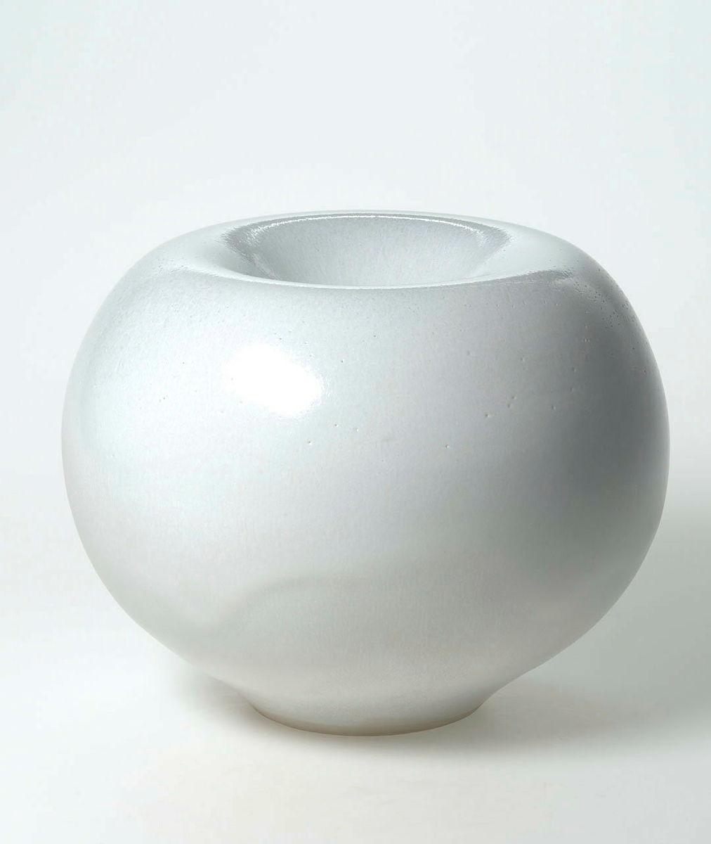 Artwork Vase this artwork made of Stoneware, thrown white stoneware clay of spherical form and indented with white matt opaque glaze.  Reduction firing at 1280 degrees Celsius, created in 1977-01-01