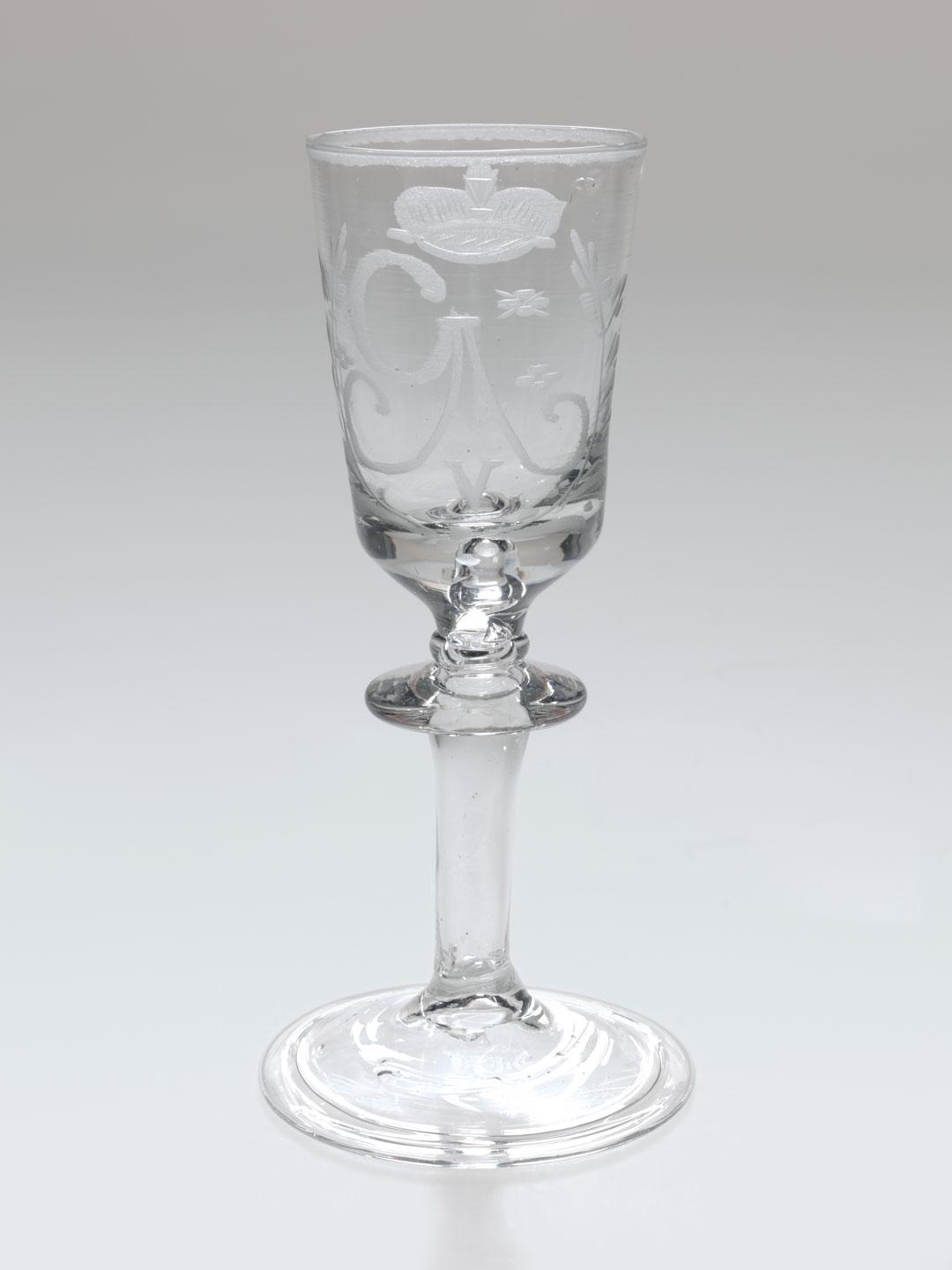 Artwork Goblet this artwork made of Glass, handblown with folded foot rim and engraved with stylised foliate motifs, a crown and "GAV" in monogram, created in 1740-01-01