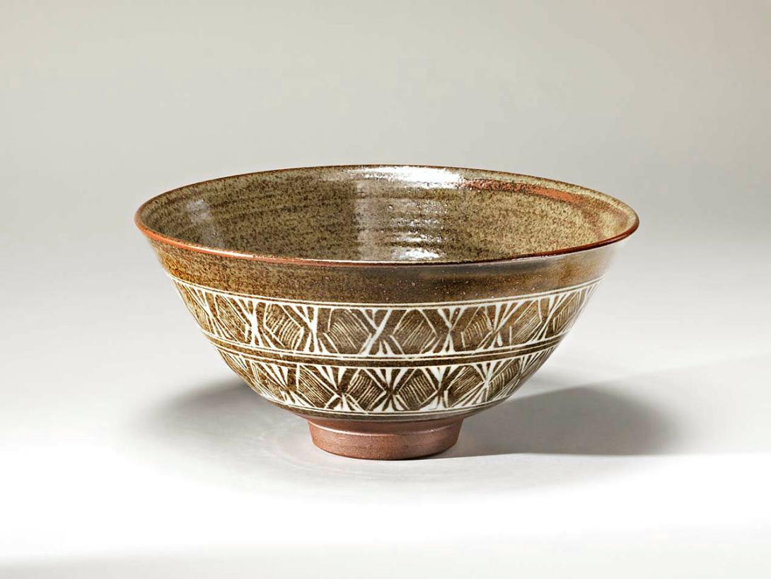 Artwork Mishima ware bowl this artwork made of Stoneware, thrown Pinjarra Hills red clay incised and with white slip inlay and limestone glaze.  Fired to 1350 degrees Celsius, created in 1981-01-01