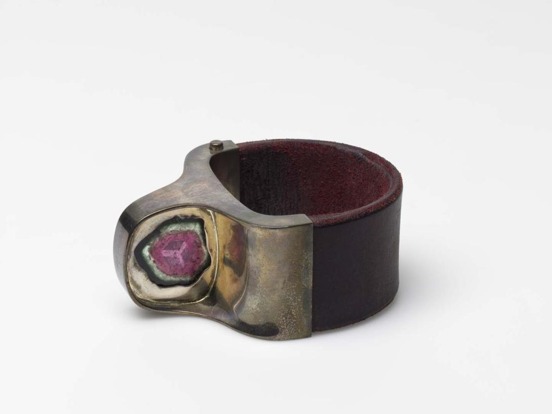 Artwork Bracelet this artwork made of Sterling silver with tourmaline inset and leather band, created in 1979-01-01