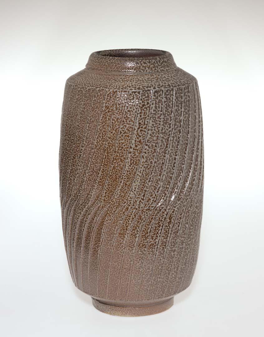 Artwork Jar this artwork made of Stoneware, thrown with fluted carved decoration and salt glaze, created in 1981-01-01