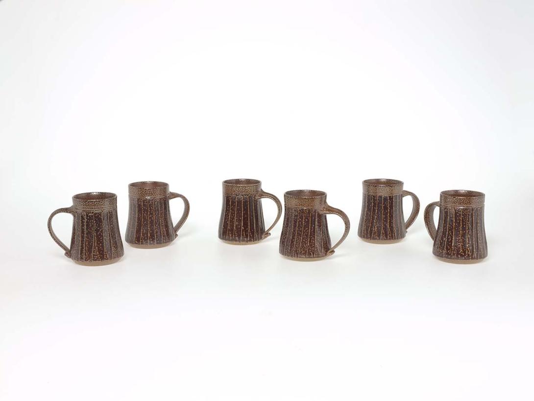 Artwork Six mugs this artwork made of Stoneware, thrown with carved fluted decoration and salt glazed