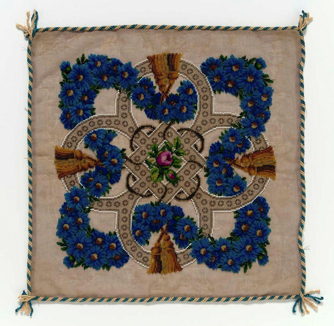 Artwork Cushion cover this artwork made of Woolen cross and pile stitch on canvas with beading. Cord edge, created in 1930-01-01