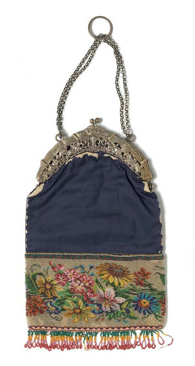 Artwork Handbag this artwork made of Silk beaded on hand made mesh with upper portion of navy silk. Clasp of silver (?), created in 1875-01-01