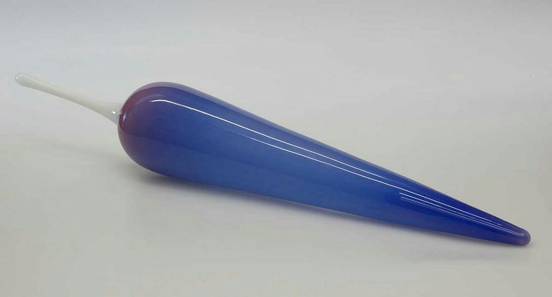 Artwork Float this artwork made of Hot-worked elongated teardrop shape glass shaded blue to mauve with white extrusion, created in 1982-01-01
