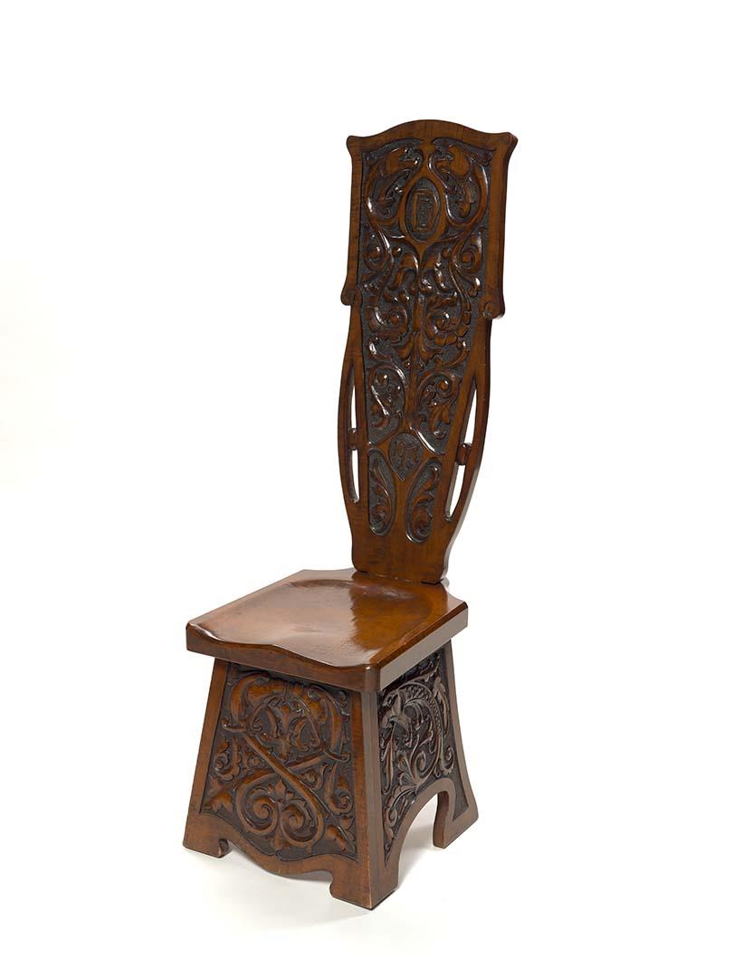 Artwork Spinning chair this artwork made of Silver ash carved with a design of stylised neo-renaissance fish, assembled and stained