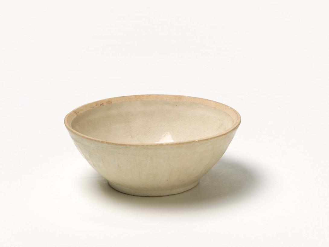 Artwork Bowl this artwork made of White clay stoneware body with relief linear decoration to exterior.  Clear glaze, created in 1271-01-01